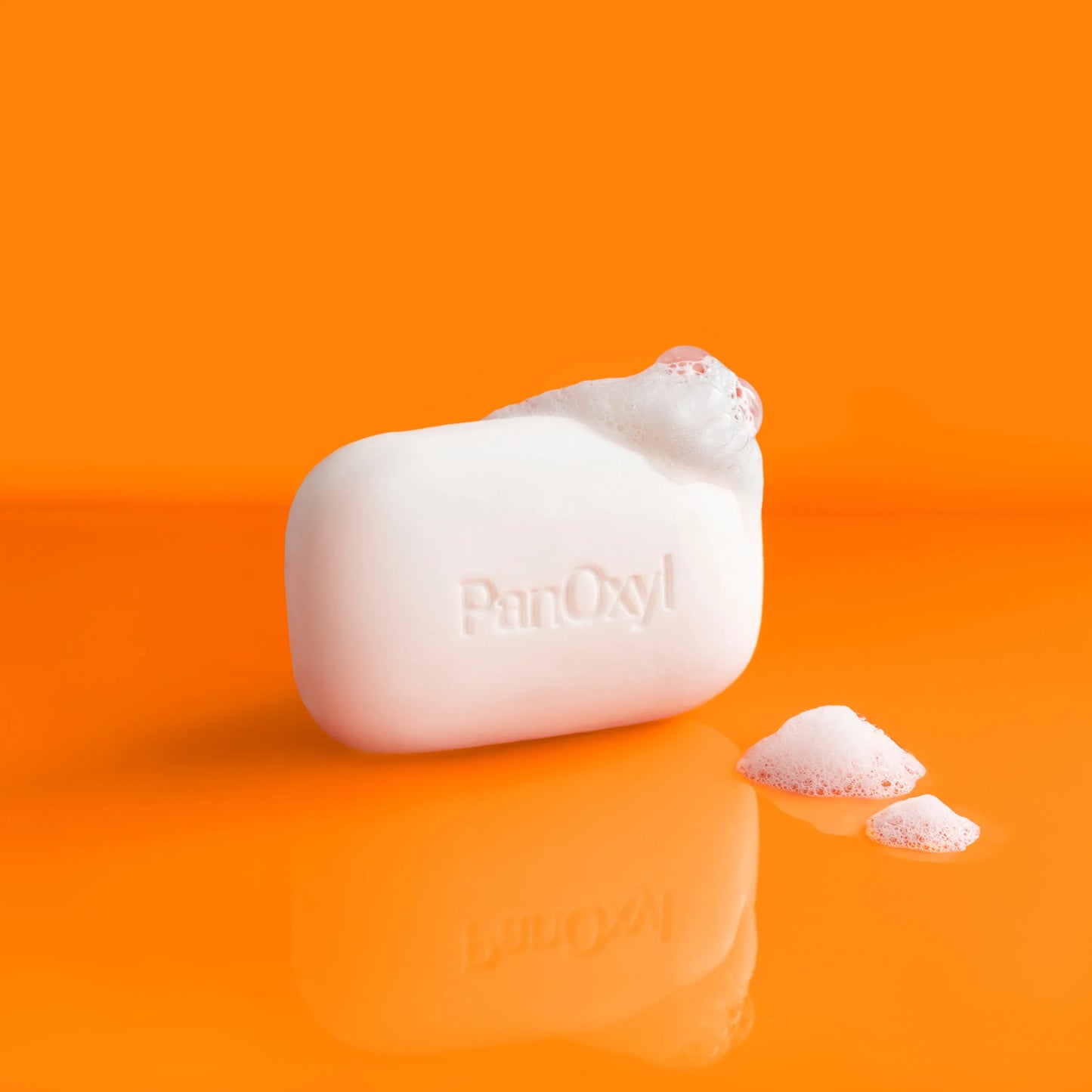 https://panoxyl.com/wp-content/uploads/2023/08/PanOxyl-Acne-Treatment-Bar-with-Suds-scaled.webp